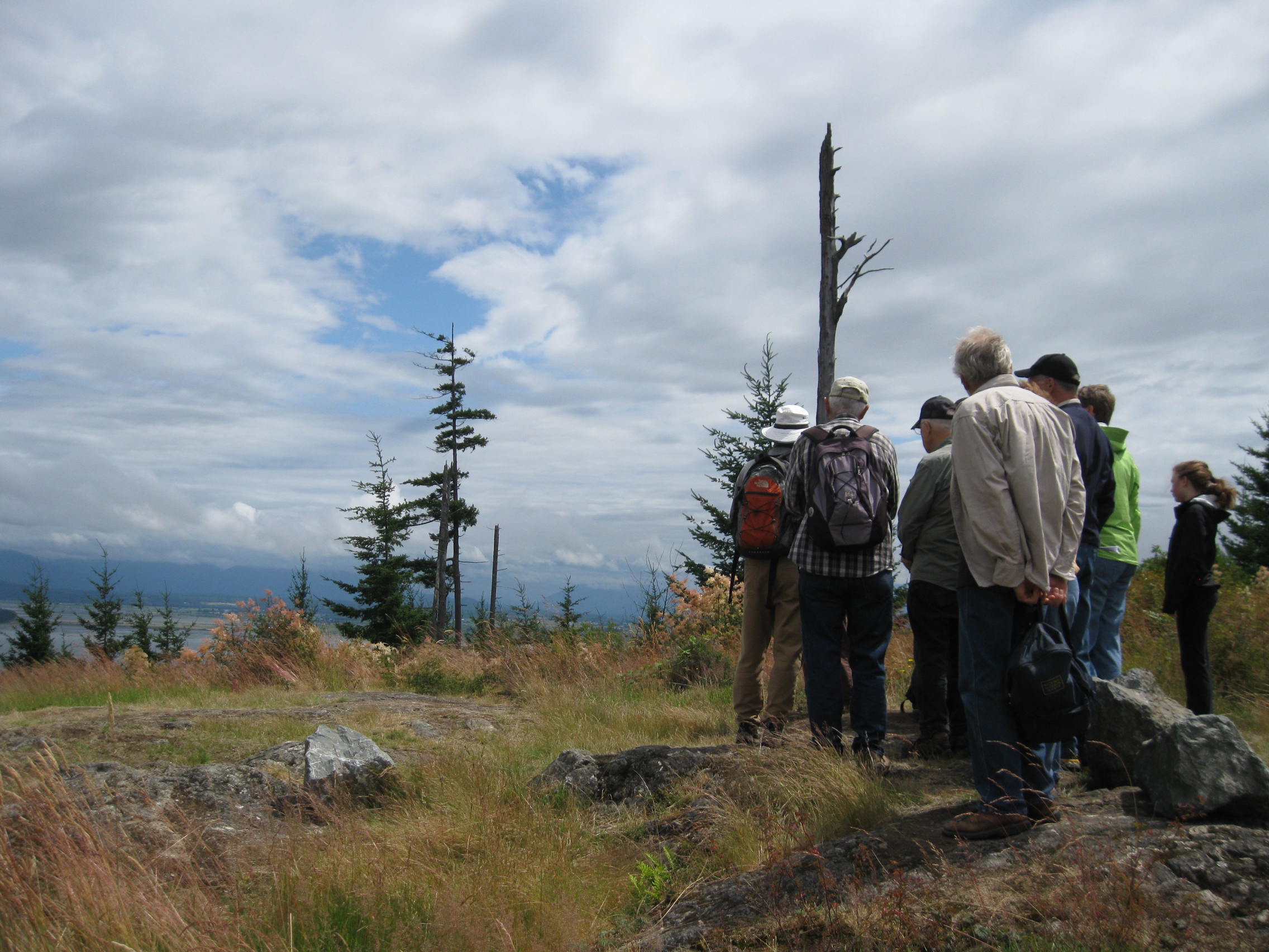 Community members participate in a tour of Guemes Mountain geology, July 2012. Photograph credit: Skagit Land Trust staff.