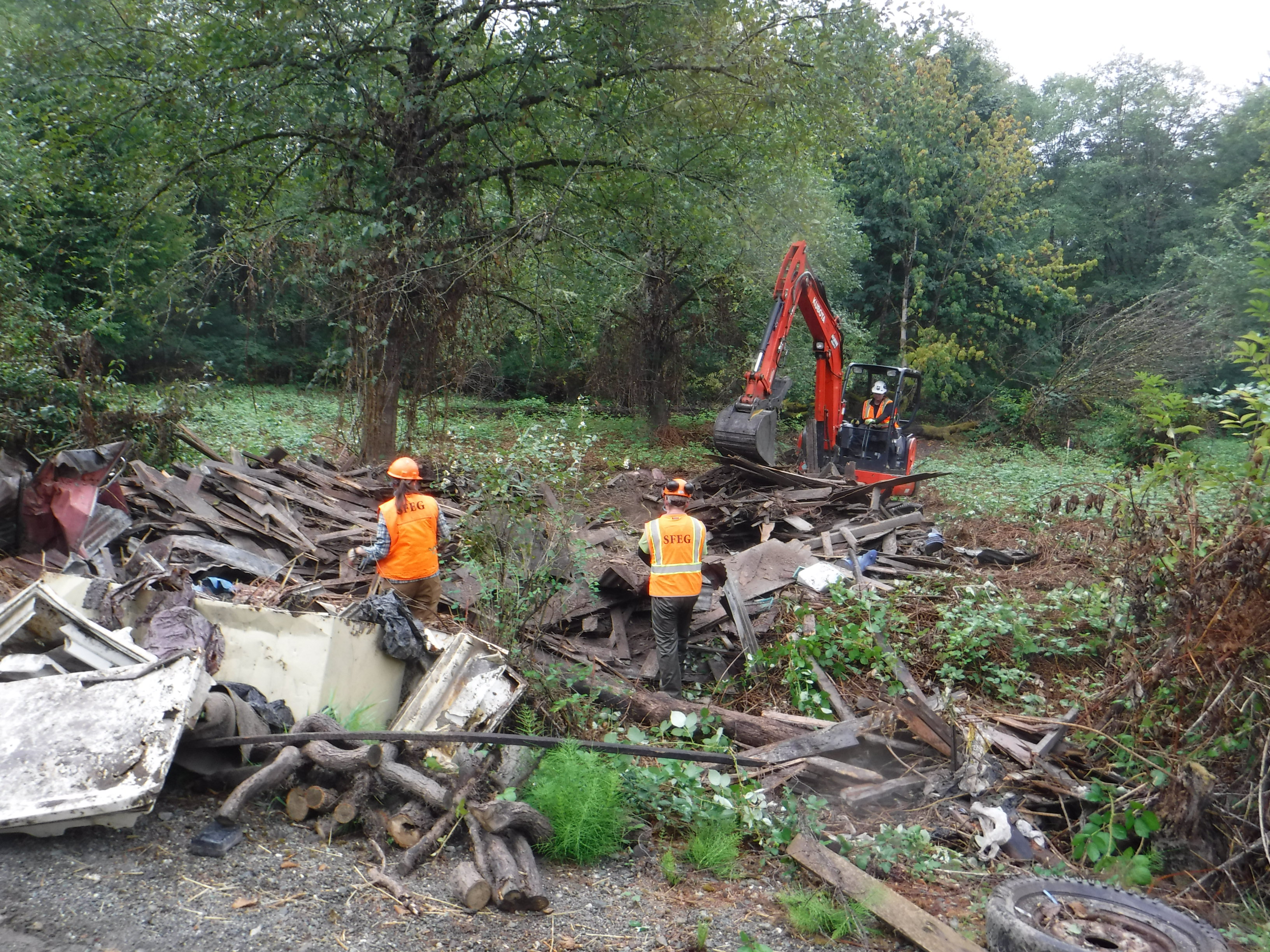 Volunteers from Skagit Fisheries Enhancement Group remove several truckloads of metal trash from Muddy Creek Conservation Area in September, 2017. Photograph credit: Skagit Land Trust staff.
